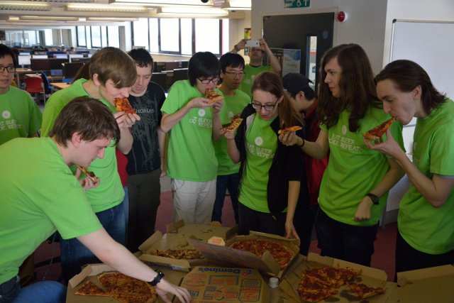 Students tucking in to free pizza